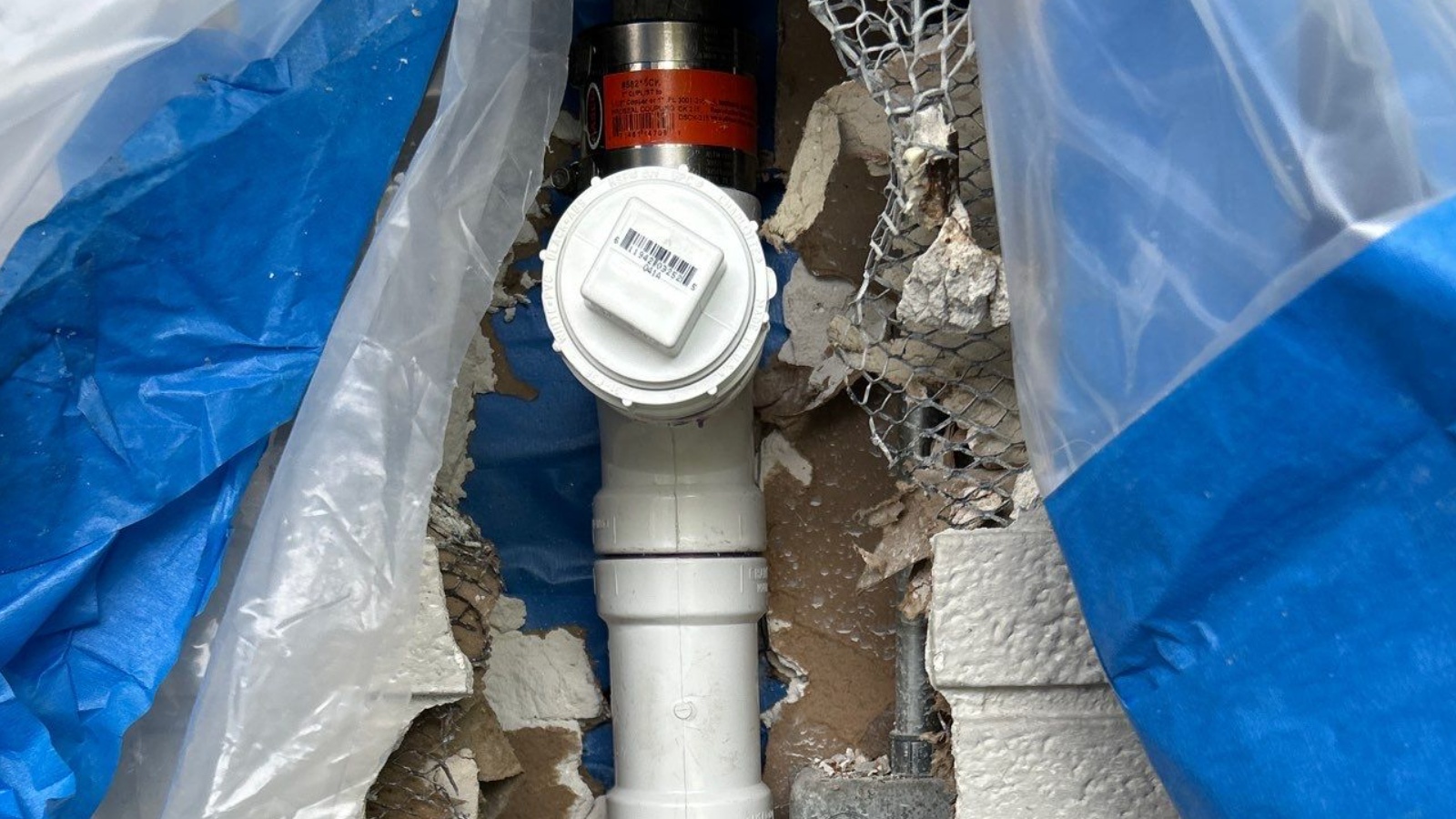 Cast Iron Replacement — Washington Street, Hollywood — after: Kitchen horizontal branch drain beneath the 3-foot by 3-foot service tunnel — completely channel-rotted cast-iron sanitary drainage piping replaced with PVC
