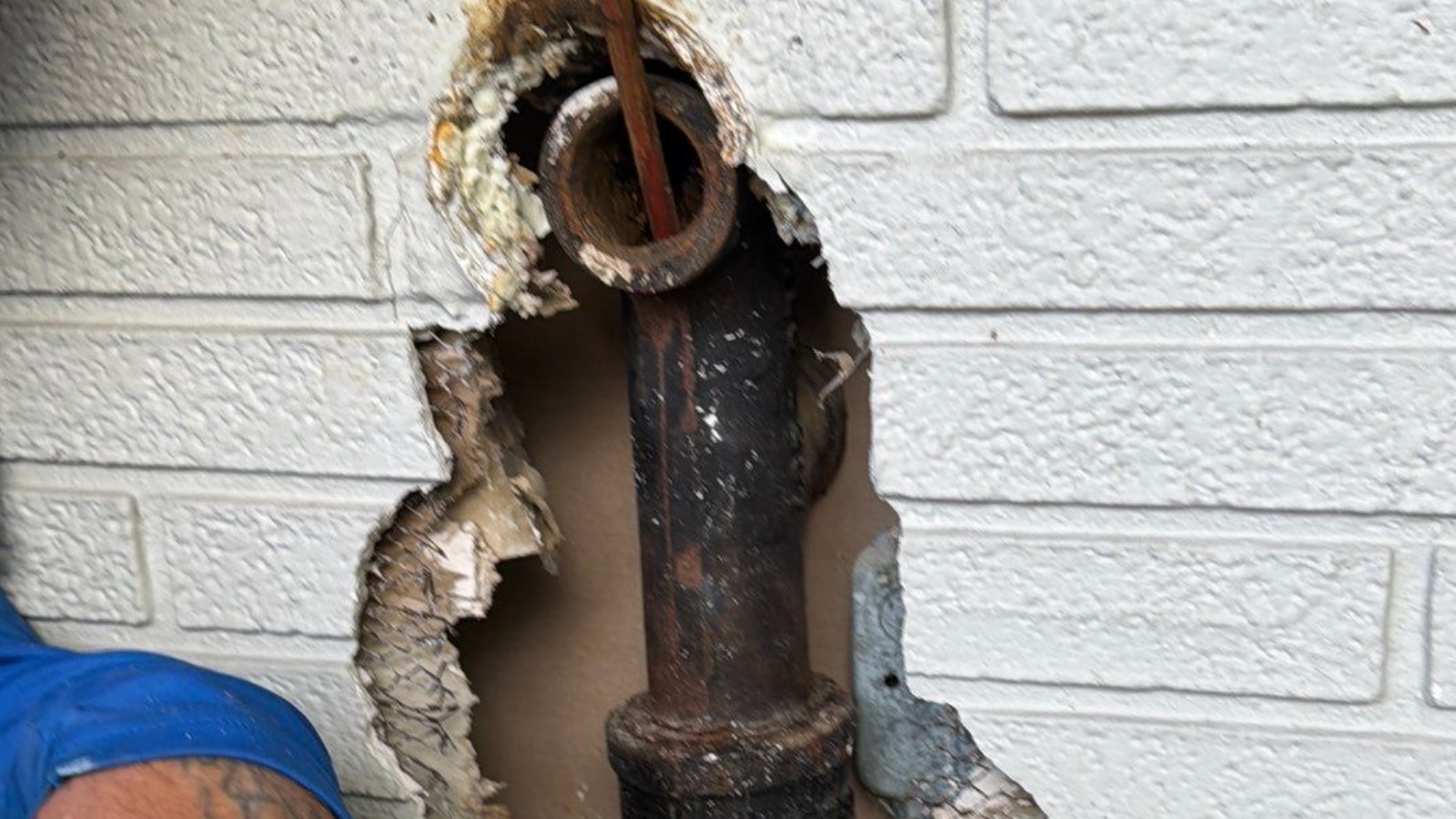 Cast Iron Replacement — Washington Street, Hollywood — before: Kitchen horizontal branch drain beneath the 3-foot by 3-foot service tunnel — completely channel-rotted cast-iron sanitary drainage piping replaced with PVC